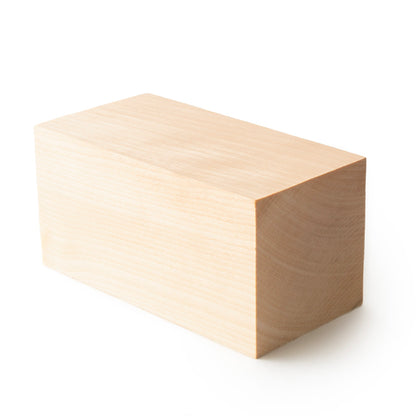 Unfinished 4" x 2" x 2" maple milestone block with a smooth, sanded surface